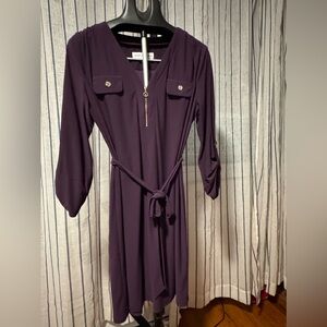 Beautiful purple dress with gold accents.